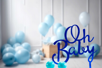 pregnancy announcement background with text Oh Baby in blue baby boy room. Greeting card, baby shower invitation, baby birth, blurred background Newborn concept