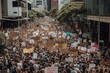 Protest Movement: A large group of people holding signs and protesting in the city, Generative AI