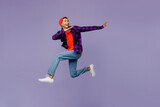 Fototapeta  - Full body side view young man of African American ethnicity wears casual shirt orange hat jump high run fast with outstretched hands isolated on plain pastel purple color background studio portrait.