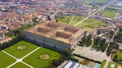 Wall Mural - Aerial view of the Royal Palace of Caserta also known as Reggia di Caserta. It is a former royal residence in Caserta, near Naples, Italy. It is the the royal garden of the building.
