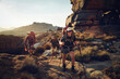 © Westend61 - Happy woman hiking with friends on Cederberg Mountain