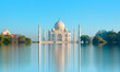 Panoramic view of Taj Mahal during bright blue sky reflected in water - Agra , Uttar Pradesh, India