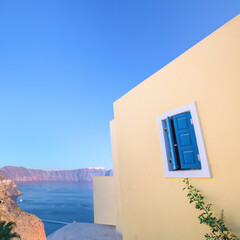 Wall Mural - Geometry and colors of sunny Santorini, Greece. Conceptual Artistic Fragments of traditional buildings in Oia on Santorini. A picturesque view of the traditional Santorini cycladic houses 