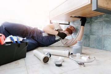 Plumber man at work in bathroom, fix repair service. Concept assemble and install plumbing