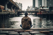 A man meditating on the riverbank. Finding Balance and Tranquility in the Heart of the City - created using Generative AI