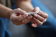 © Seventyfour - Close up of female hands rolling up cigarette for therapeutic purpose and medical treatment, copy space