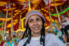 Close Up Of Woman Talking In Amusement Park