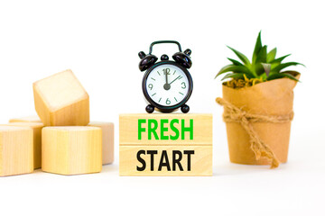 Wall Mural - Fresh start and motivational symbol. Concept words Fresh start on wooden block. Beautiful white table white background. Black alarm clock. Business motivational and Fresh start concept. Copy space.