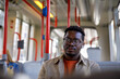 © Jovo Jovanovic/Stocksy - Man looking away while listening music and traveling in tram