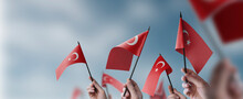 A Group Of People Holding Small Flags Of The Turkey In Their Hands