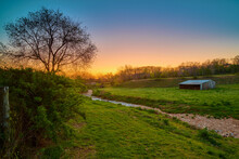 Sunset Over A Farm With Old Barn Near Bentonville Arkansas.