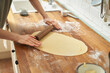 © Pietro Karras/Stocksy - Rolling the dough