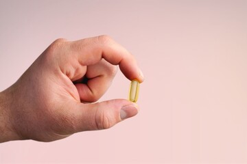 Canvas Print - Hand holding the medical pill or supplements