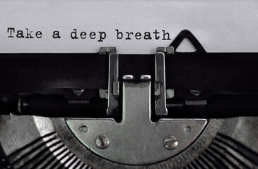 Poster - text take a deep breath typed on retro typewriter
