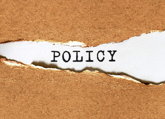 Poster - text policy appearing behind torn brown paper