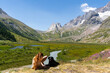 © Alba Vitta/Stocksy - Hiker woman and dog in the mountain