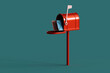 © Giada Canu/Stocksy - red mailbox with mails