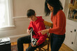 © Léa Jones/Stocksy - teen getting guitar lesson