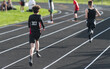 © Melanie DeFazio/Stocksy - Highschool boy running track