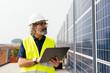 © BONNINSTUDIO/Stocksy - Male engineer with digital tablet near solar panels