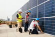 © BONNINSTUDIO/Stocksy - Workers examining solar power station