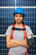 © BONNINSTUDIO/Stocksy - Engineer female in front of solar power station