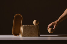 Still Life Of Architectural Objects With Hand Reaching In 