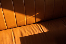 Brown Leather Couch With Hard Direct Sunlight 