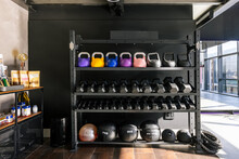 Gym Rack With A Set Of Dumbbells, Kettlebells And Exercise Balls