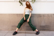 © María Soledad Kubat/Stocksy - Sunny lifestyle fashion portrait of young stylish hipster woman