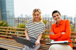 © BONNINSTUDIO/Stocksy - Cheerful women working on office rooftop