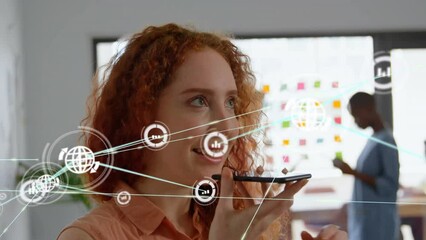 Poster - Animation of network of digital icons against caucasian woman talking on smartphone at office