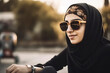 © Nedrofly - A Arabian woman wearing a headscarf and sunglasses created with Generative AI technology