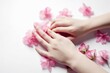 © top images - Close-up of beautiful female hands with flowers. The concept of hand care anti-aging cream and spa. AI generated