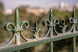 Decorative fence in Paris, France, in the beautiful Parc des Buttes Chaumont. Very shallow focus for artistic effect on the first spike.