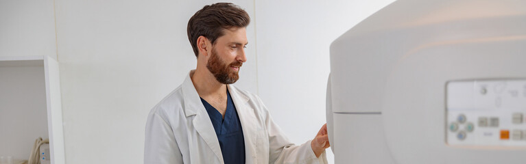 Wall Mural - Radiologist controls MRI or CT or PET Scan with female patient undergoing procedure
