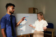 © DragonImages - Businessman giving his opinion on presentation to colleague