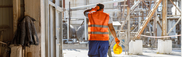 multiracial man working hard at construction industry plant