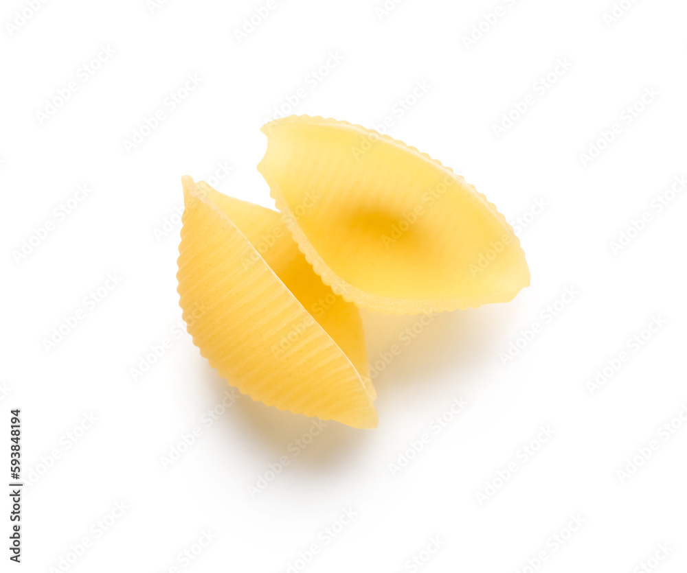 Raw conchiglie pasta isolated on white background