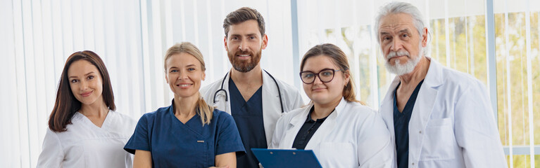 portrait of a group of happy and successful doctors and nurses in hospital