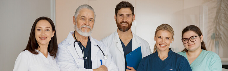 Wall Mural - Portrait of a group of happy and successful doctors and nurses in hospital