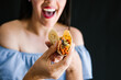 © Marcos - Mexican woman eating tacos al pastor, mexican food in Mexico Latin America
