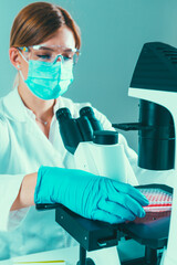 Wall Mural - Female biotechnology scientist working in laboratory