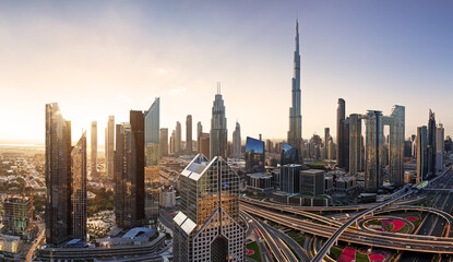 Wall Mural - Dramatic sunrise over Dubai skyline panorama with Burj Khalifa and luxury skyscrapers, United Arab Emirates