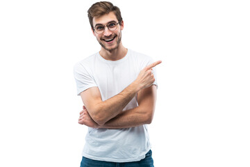 Portrait of a joyful young man pointing fingers away at copy space on his palm isolated over transparent background