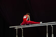 male gymnast exercise on parallel bars competition artistic gymnastics, black background