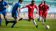 © Gorodenkoff - Stadium Soccer Football Match International Championship. Red Team Attacks, Plays in Pass, Dribbling. Blue Team Tries To Tackle. World Tournament. Live Sports Broadcast Channel Television Concept.