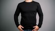 White man model wearing a plain black long sleeve t-shirt, isolated on a blank background. Mock-up, torso only. Generative AI illustration.