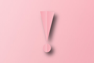 Wall Mural - Pink paper cut into exclamation mark shapes. warning sign set on pink paper background