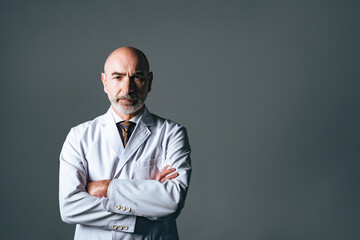 Portrait of a senior man wearing a white coat. Doctor. Professor.